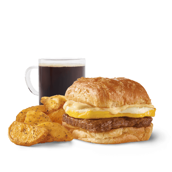 Croissant con salchicha, huevo y queso suizo